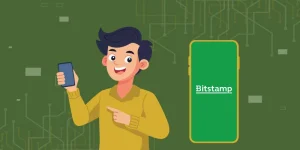 Illustration of a happy user holding a smartphone, pointing to a mobile screen displaying the Bitstamp logo, symbolizing the sign-up process.