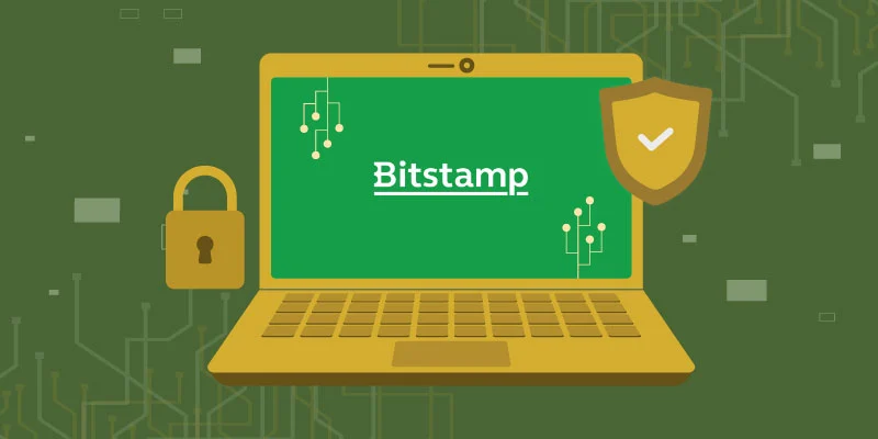 Illustration of a laptop displaying the Bitstamp logo, accompanied by a security shield and a padlock, symbolizing platform security.