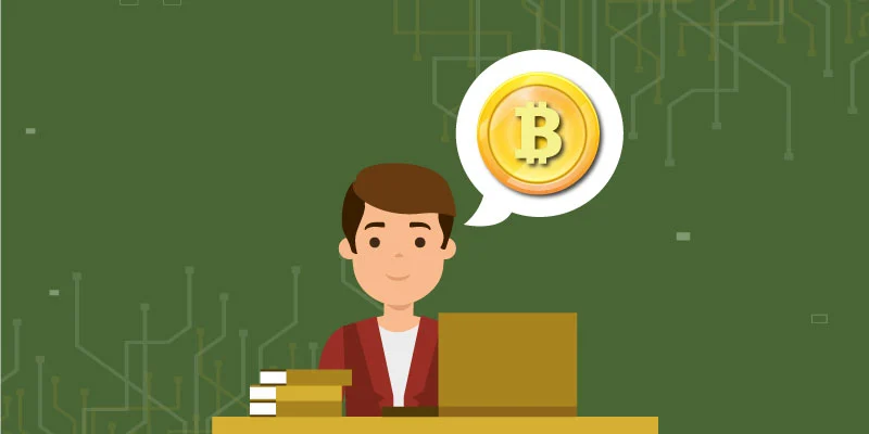 Beginner learning about Bitcoin and cryptocurrency for beginners at a desk with books and laptop