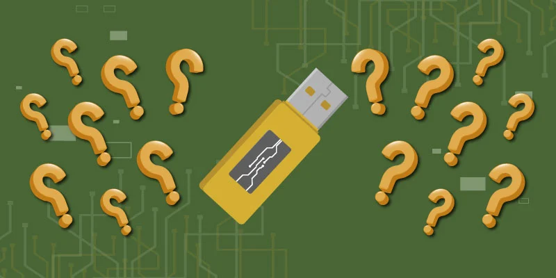 Cold wallet USB device surrounded by question marks, symbolizing curiosity about offline cryptocurrency storage